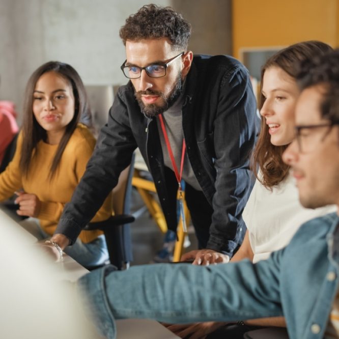 Lecturer,Helps,Scholar,With,Project,,Advising,On,Their,Work.,Teacher