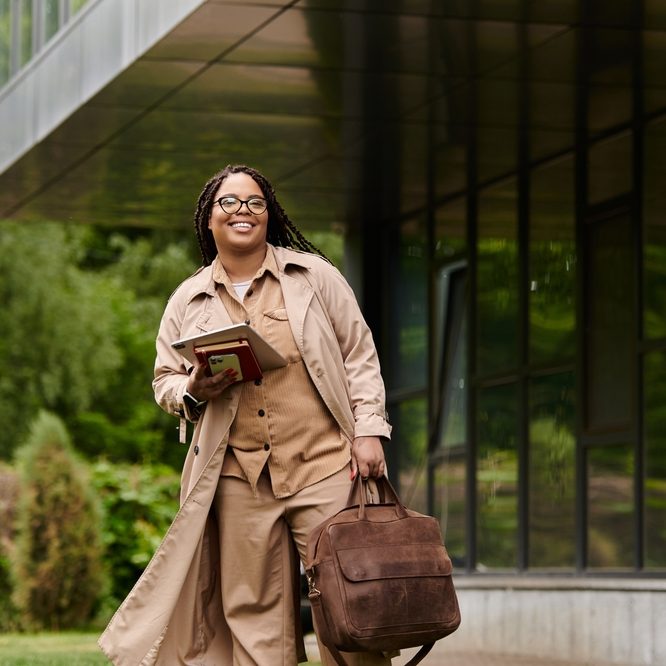 A,University,Teacher,Strolls,Joyfully,Around,The,Campus,,Holding,Her